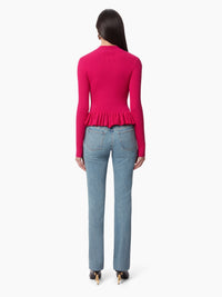 PULL AVEC UN PEPLUM À VOLANTS