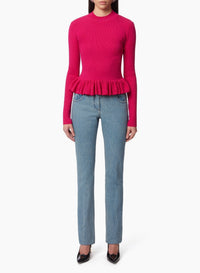 PULL AVEC UN PEPLUM À VOLANTS