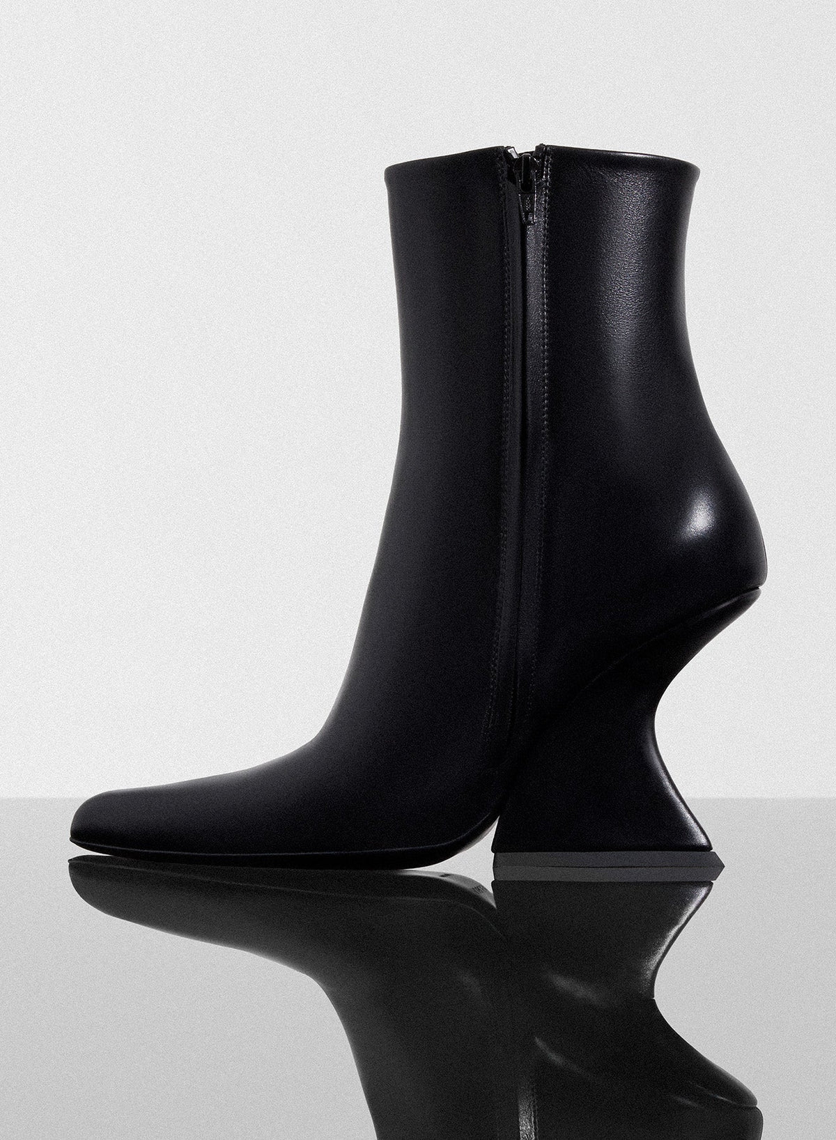 BLACK // black curved heel ankle boots