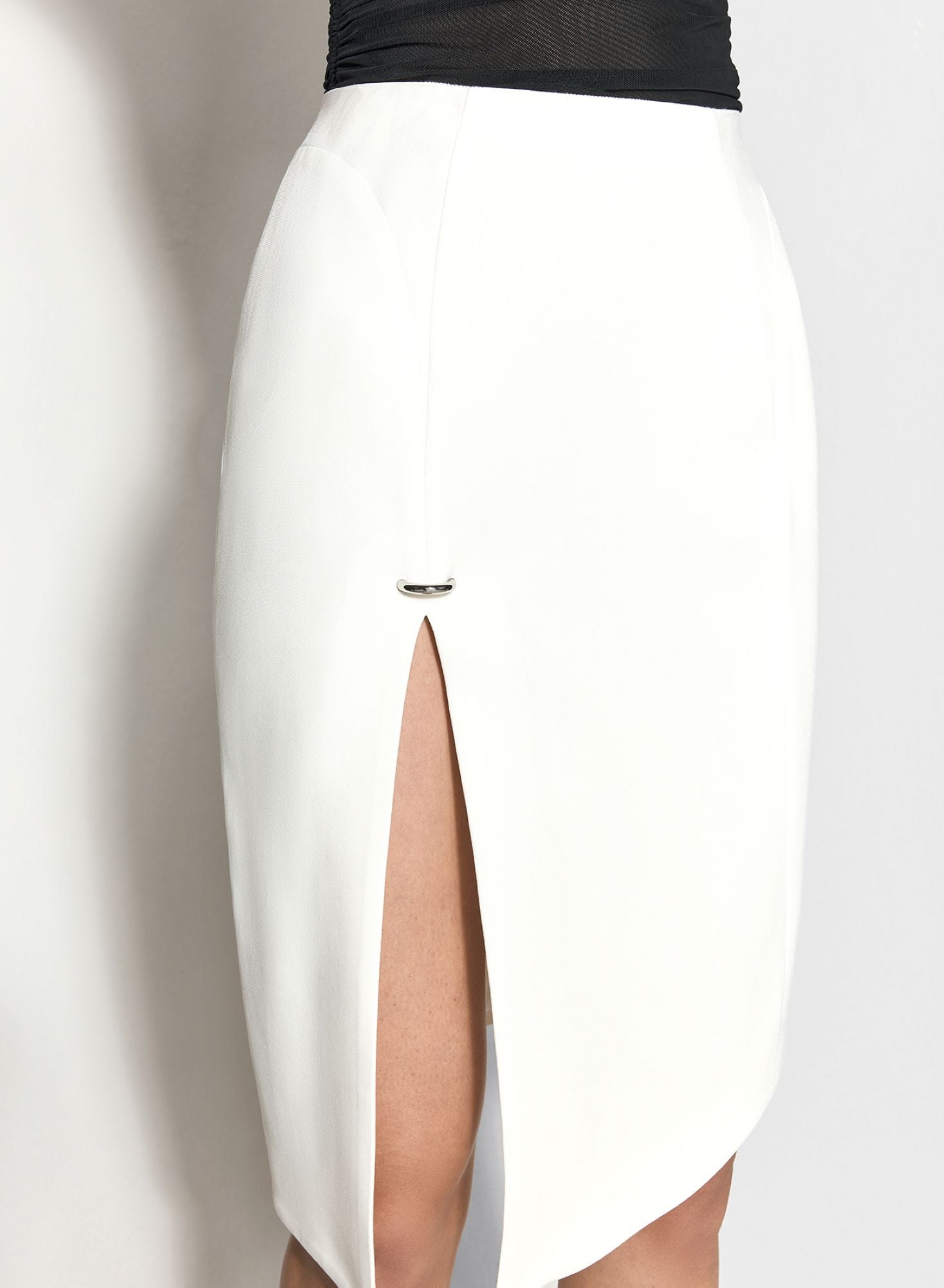 WHITE ASYMETRICAL PIERCED SKIRT
