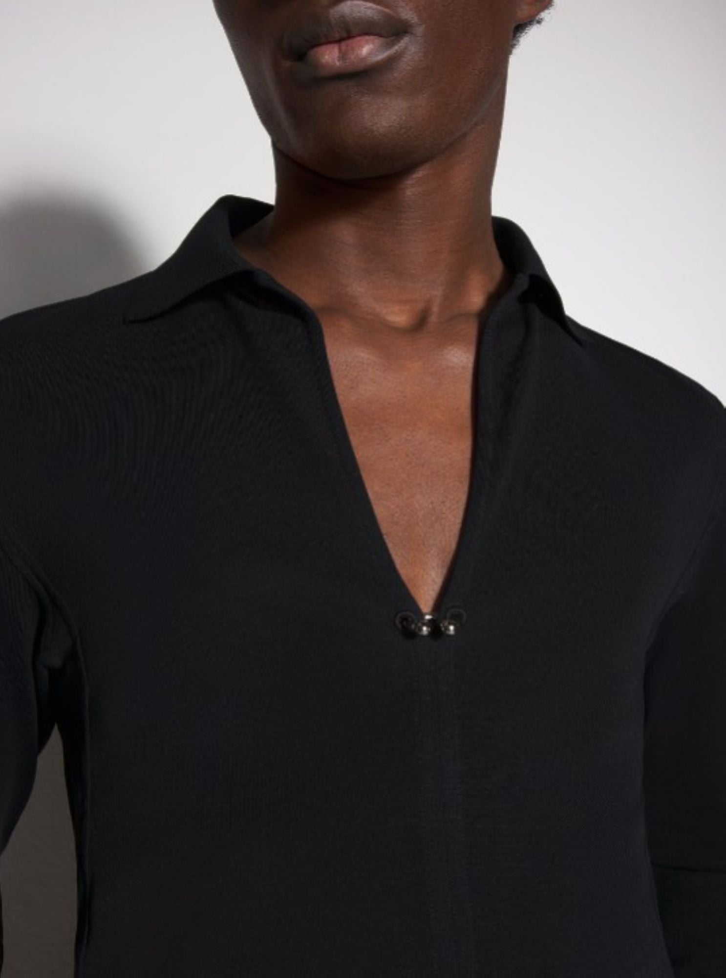 BLACK PIERCED POLO