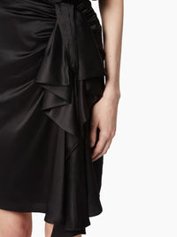 JUPE AVEC DÉTAIL D’ARC ASYMÉTRIQUE
