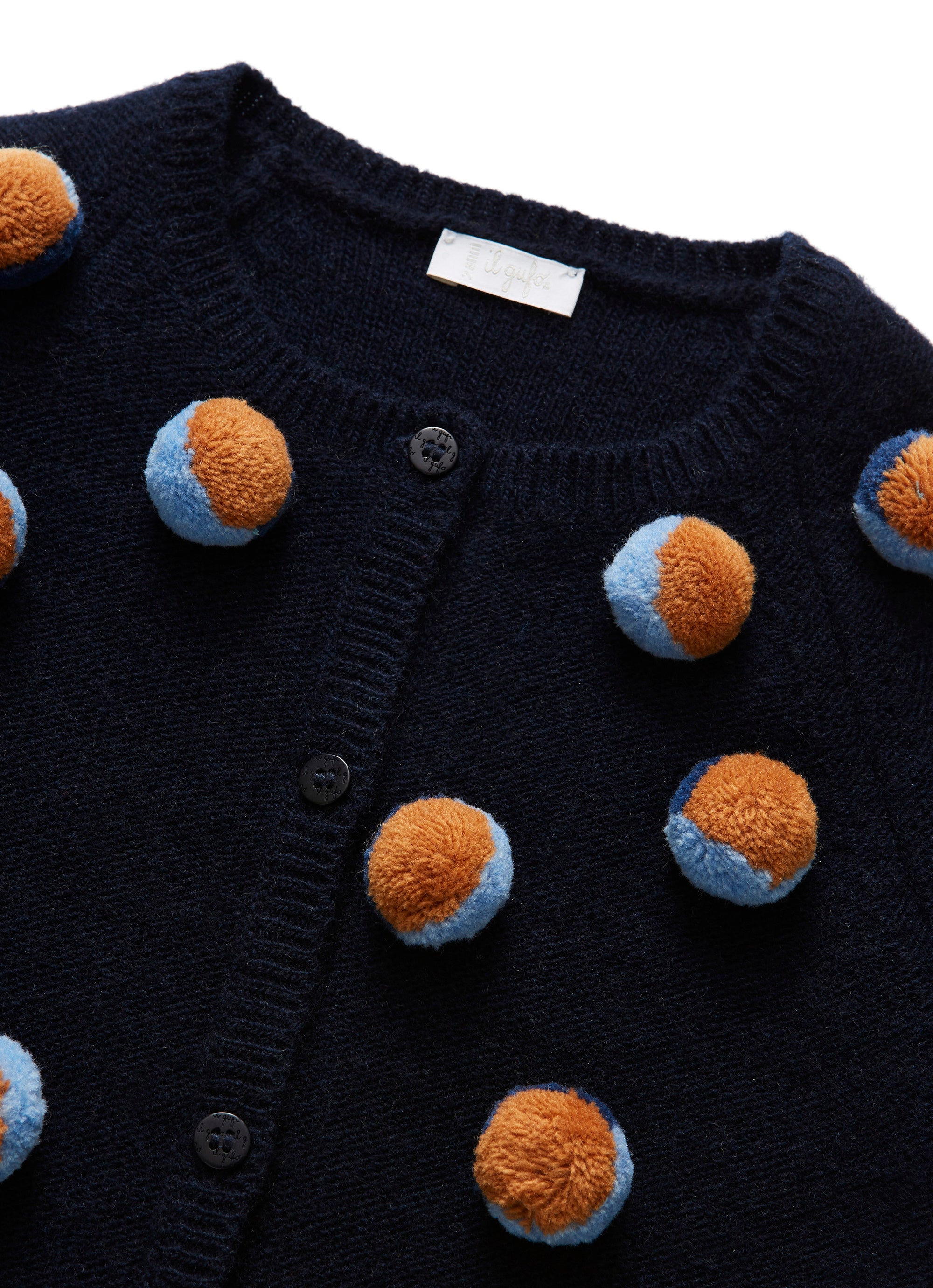 Tricot cardigan with pom poms