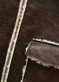 Brown faux-sheepskin jacket with contrast curly trim