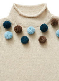 Beige little sweater with pom poms