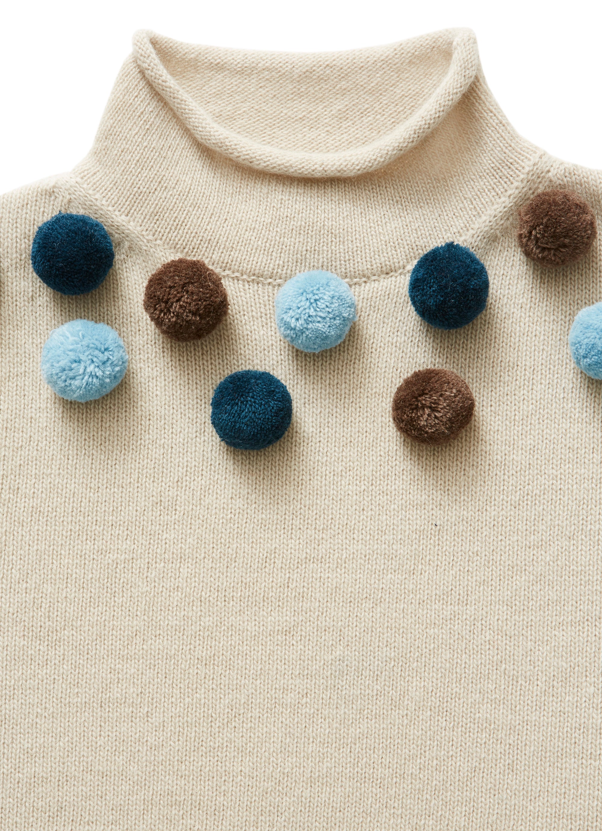 Beige little sweater with pom poms