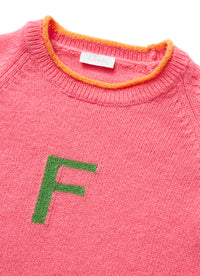 Shocking pink sweater with lettering