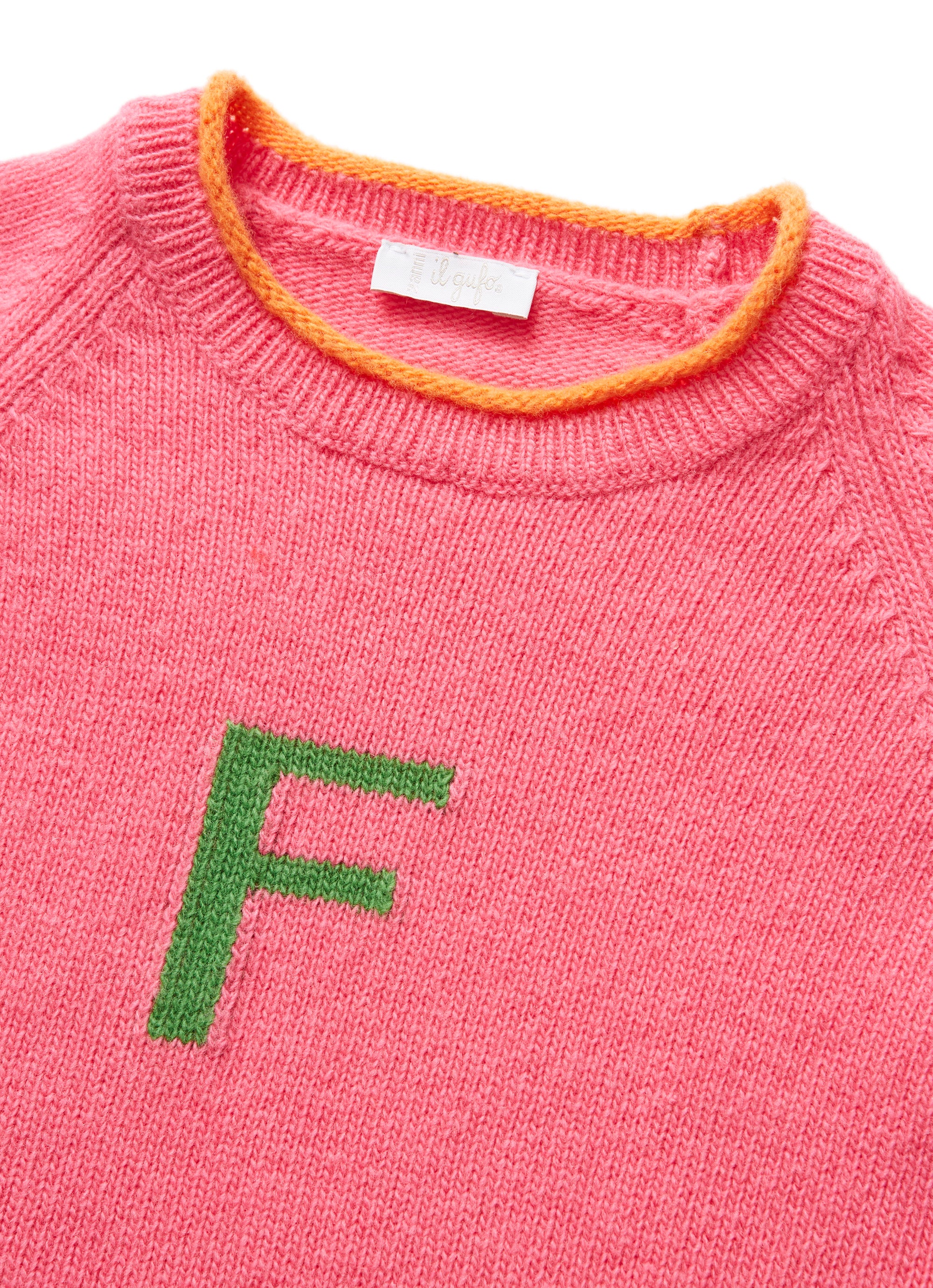 Shocking pink sweater with lettering