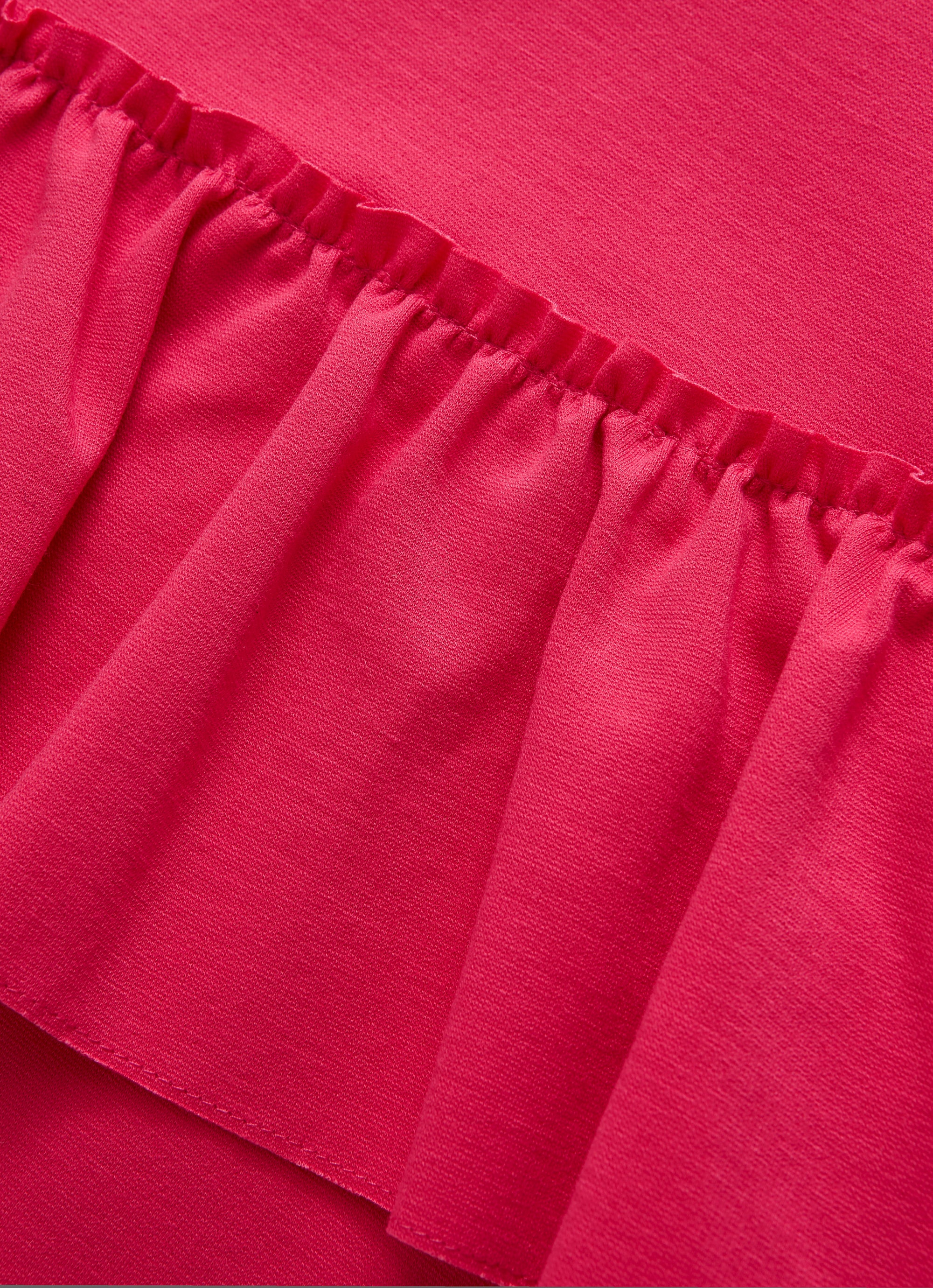 Crew-neck dress with asymmetric ruffles
