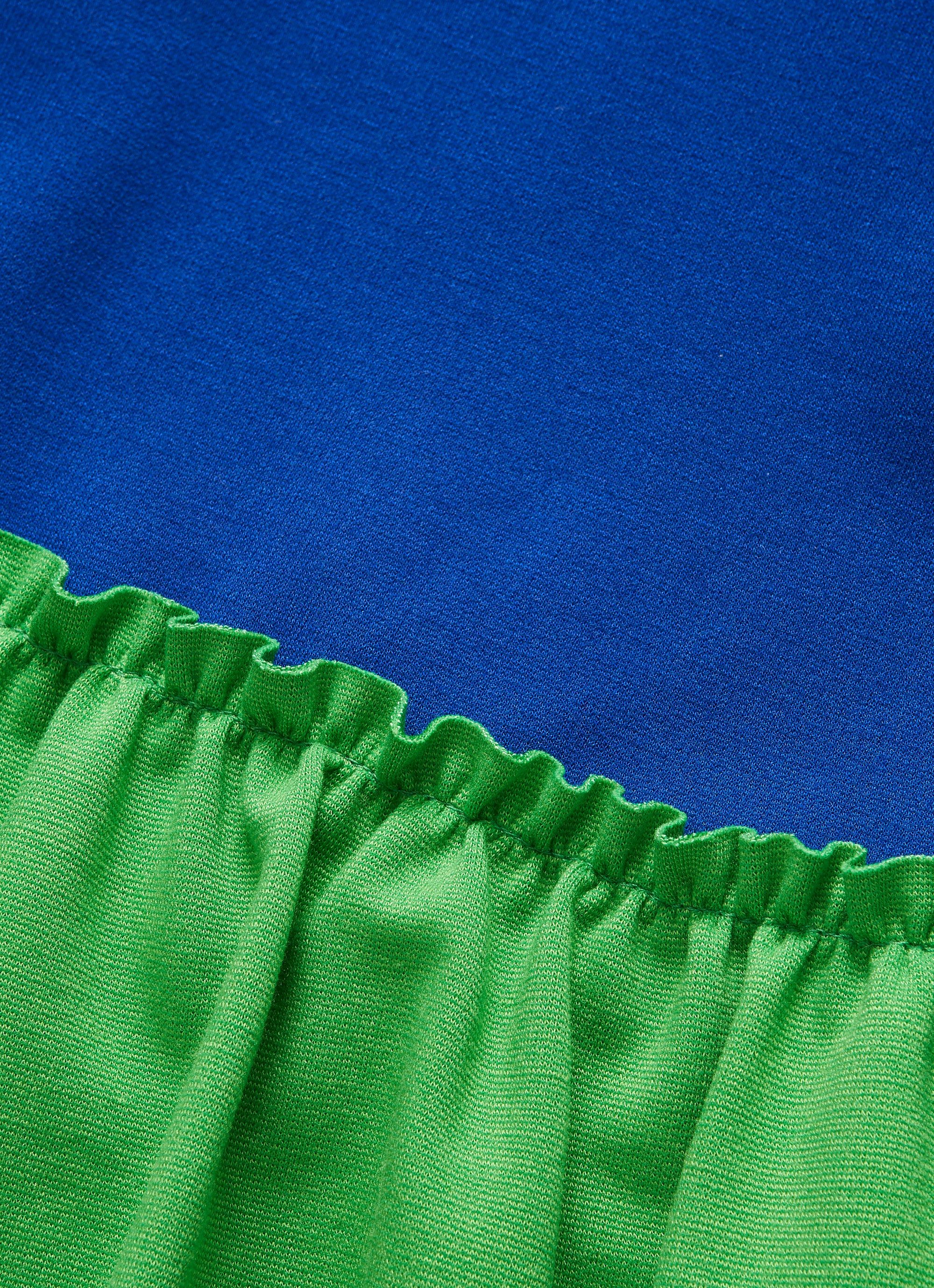 Blue dress with green ruffles