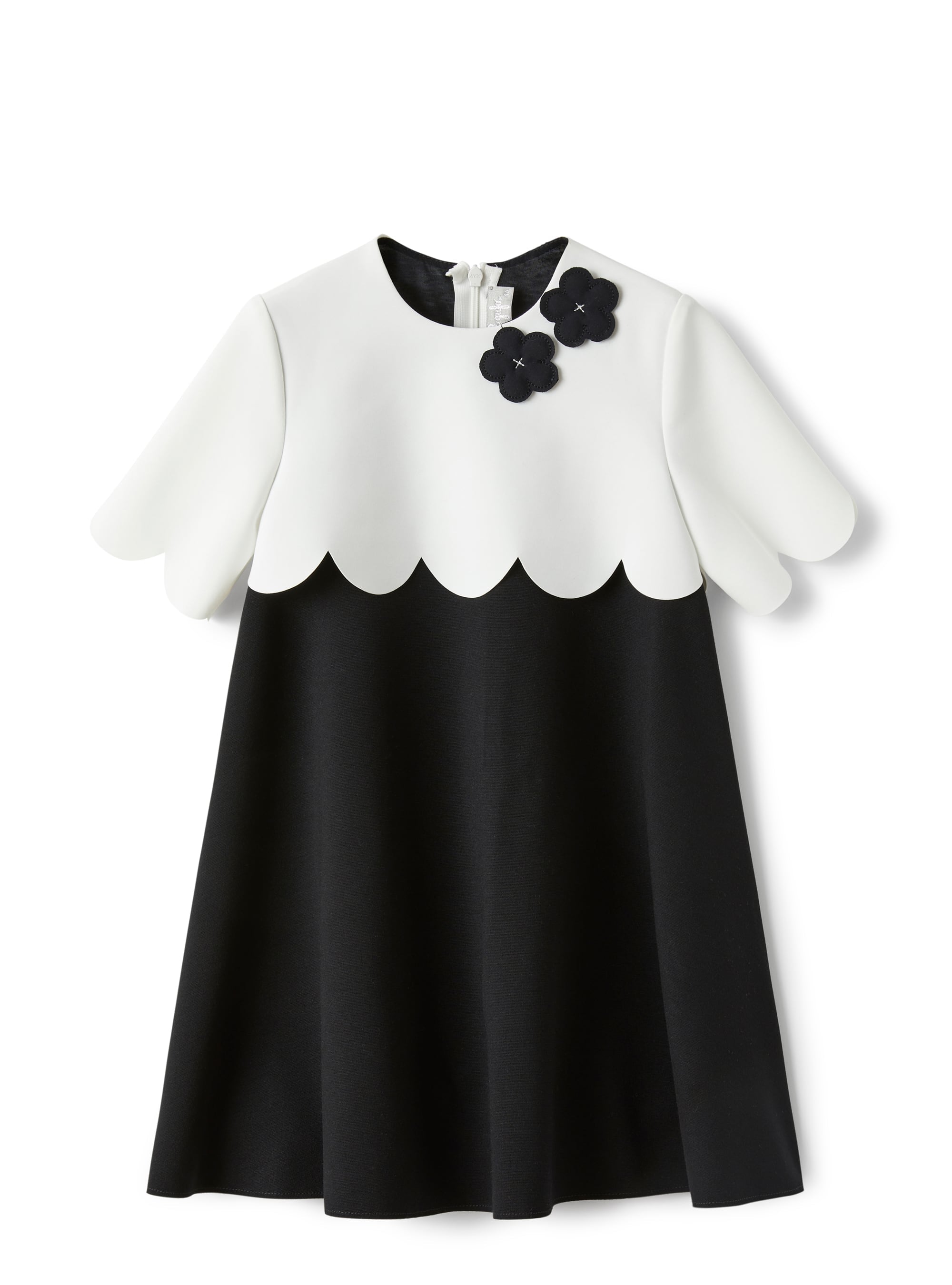 Dress in two different materials with flower embellishment