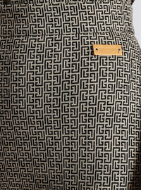 Pantalon flare en jacquard monogramme - Ivoire & Noir