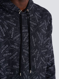 Hoodie imprimé motif étiquette balmain all-over - Noir & Blanc
