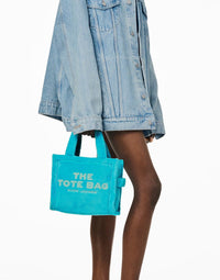 PETIT   Petit sac à bandoulière The Tote Bag en fausse fourrure - Pool