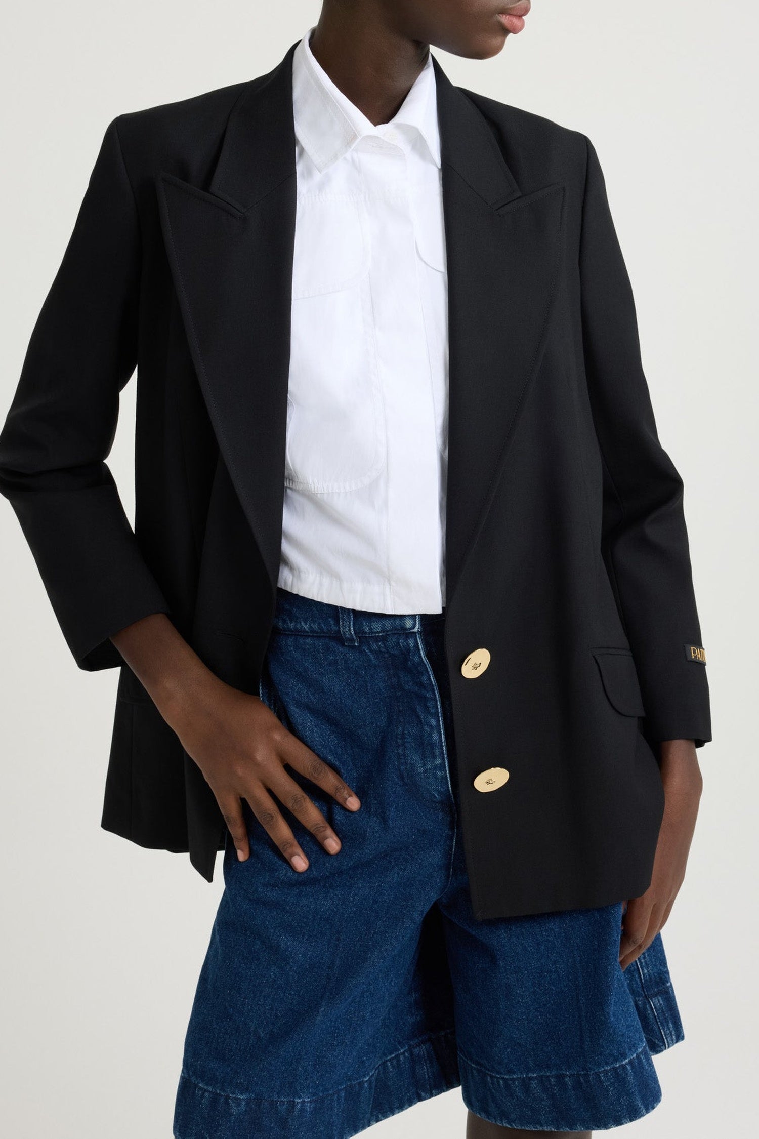 Veste en laine à bouton bijou