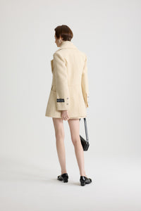 No Label Snowberry White / Veste longiligne à boutonnage simple en tweed de laine mélangée éco-responsable
