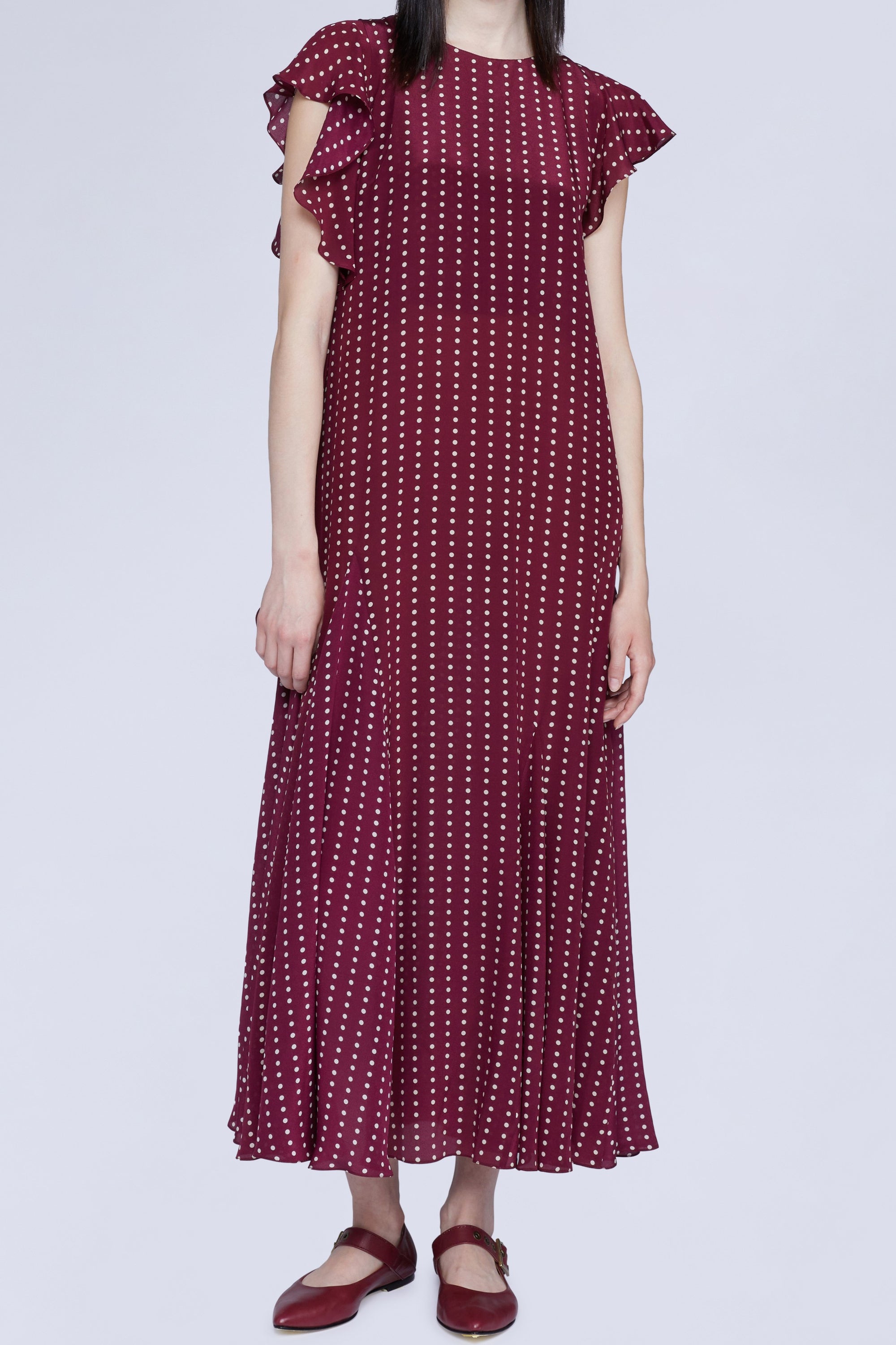 ROBE MIDI À POIS AVEC DÉTAIL VOLANT SUR LE CÔTÉ