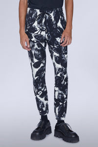 Pantalon avec revers imprimé fleurs noir et blanc