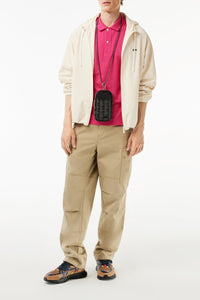 L.12.12 Fitted polo shirt in small pique - Spinelle
