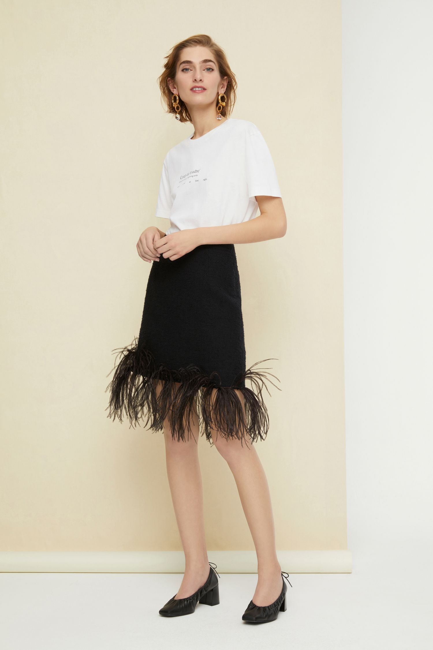 Jupe courte en tweed à plumes - Noir