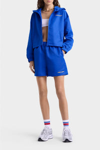 Veste coupe-vente à capuche Bold Health en satin - Paris Blue