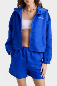 Veste coupe-vente à capuche Bold Health en satin - Paris Blue