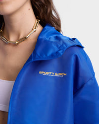 Veste coupe-vente à capuche Bold Health en satin - Paris Blue