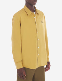 Large shirt with embroidered badge - Trench coat