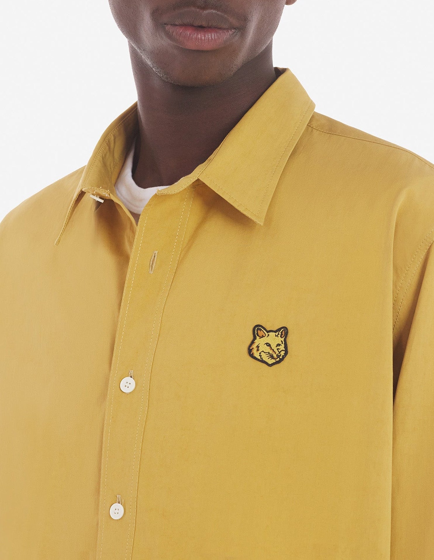 Large shirt with embroidered badge - Trench coat