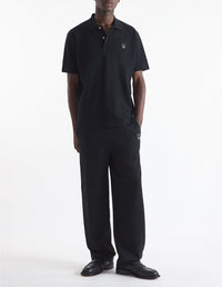 Short-sleeved polo shirt with badge - Black