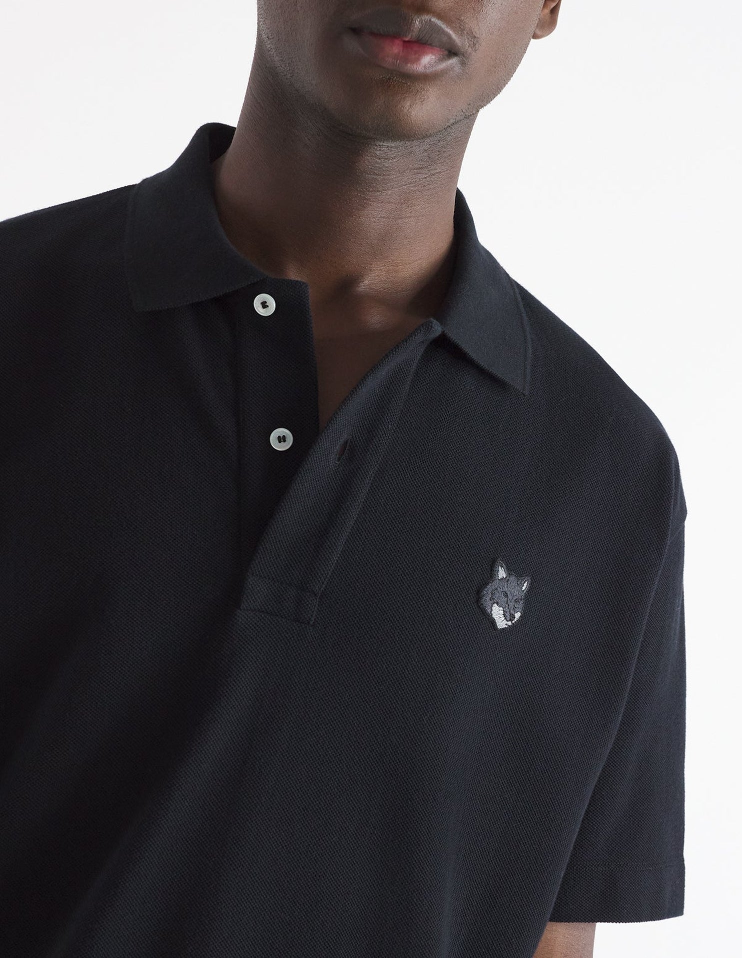 Short-sleeved polo shirt with badge - Black