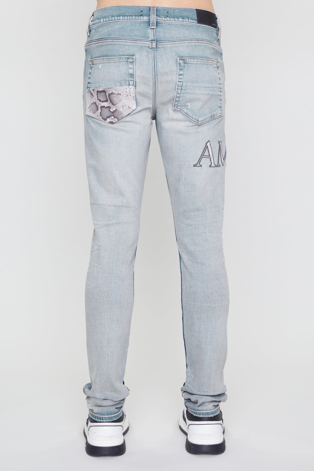 AMIRI SNAKE LOGO SKINNY JEAN