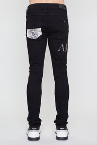 AMIRI SNAKE LOGO SKINNY JEAN
