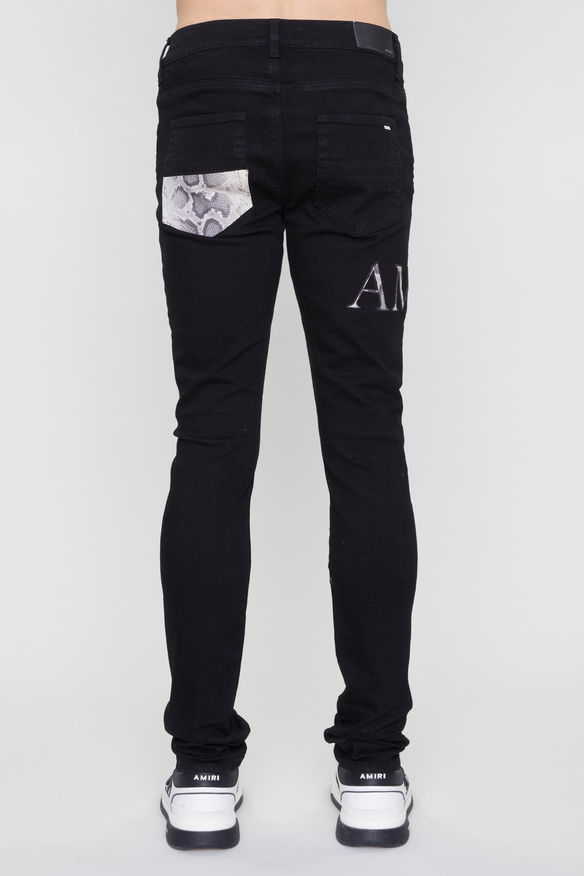 AMIRI SNAKE LOGO SKINNY JEAN